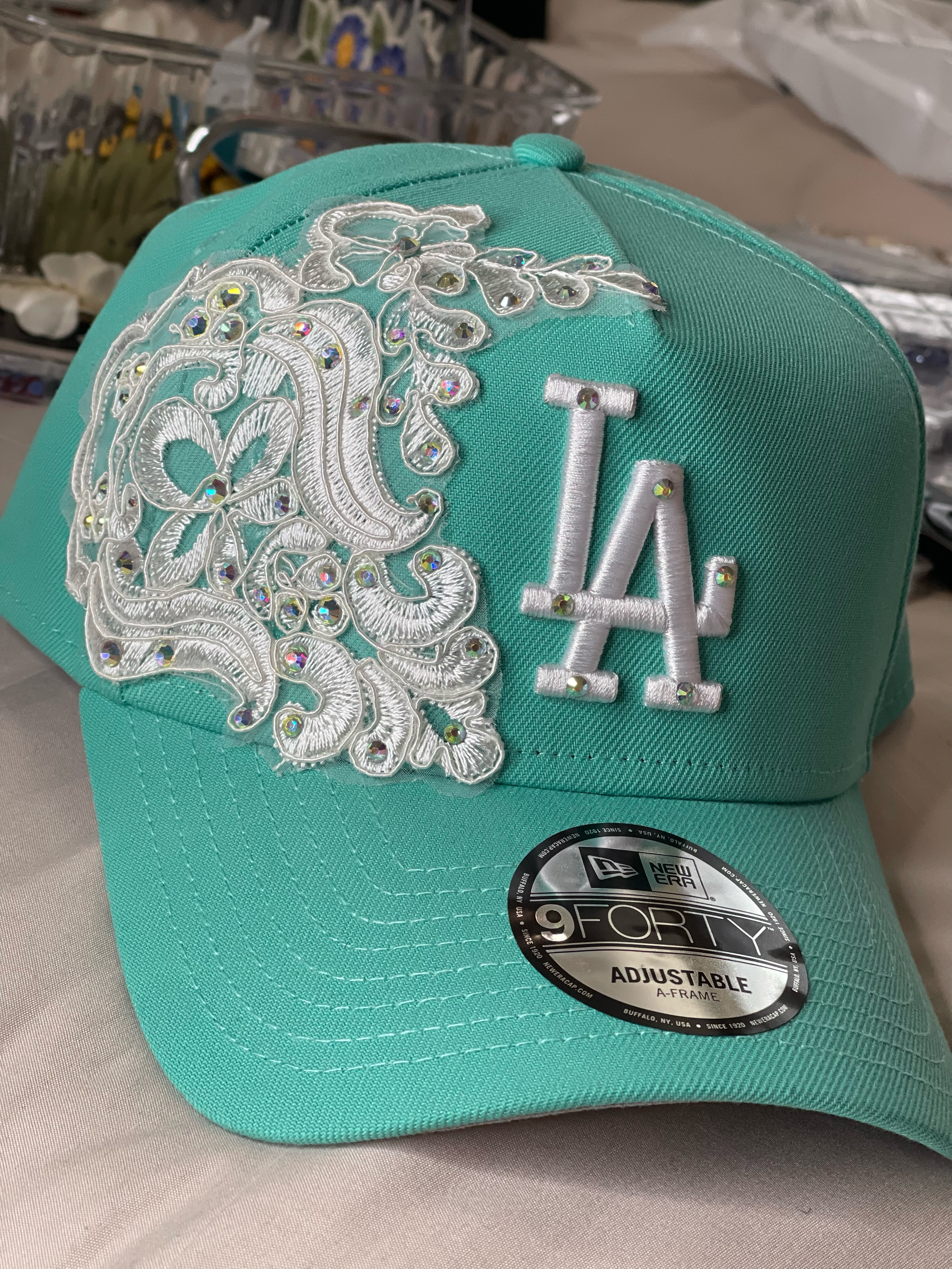 Teal LA snapback with white lace applique and iridescent crystals