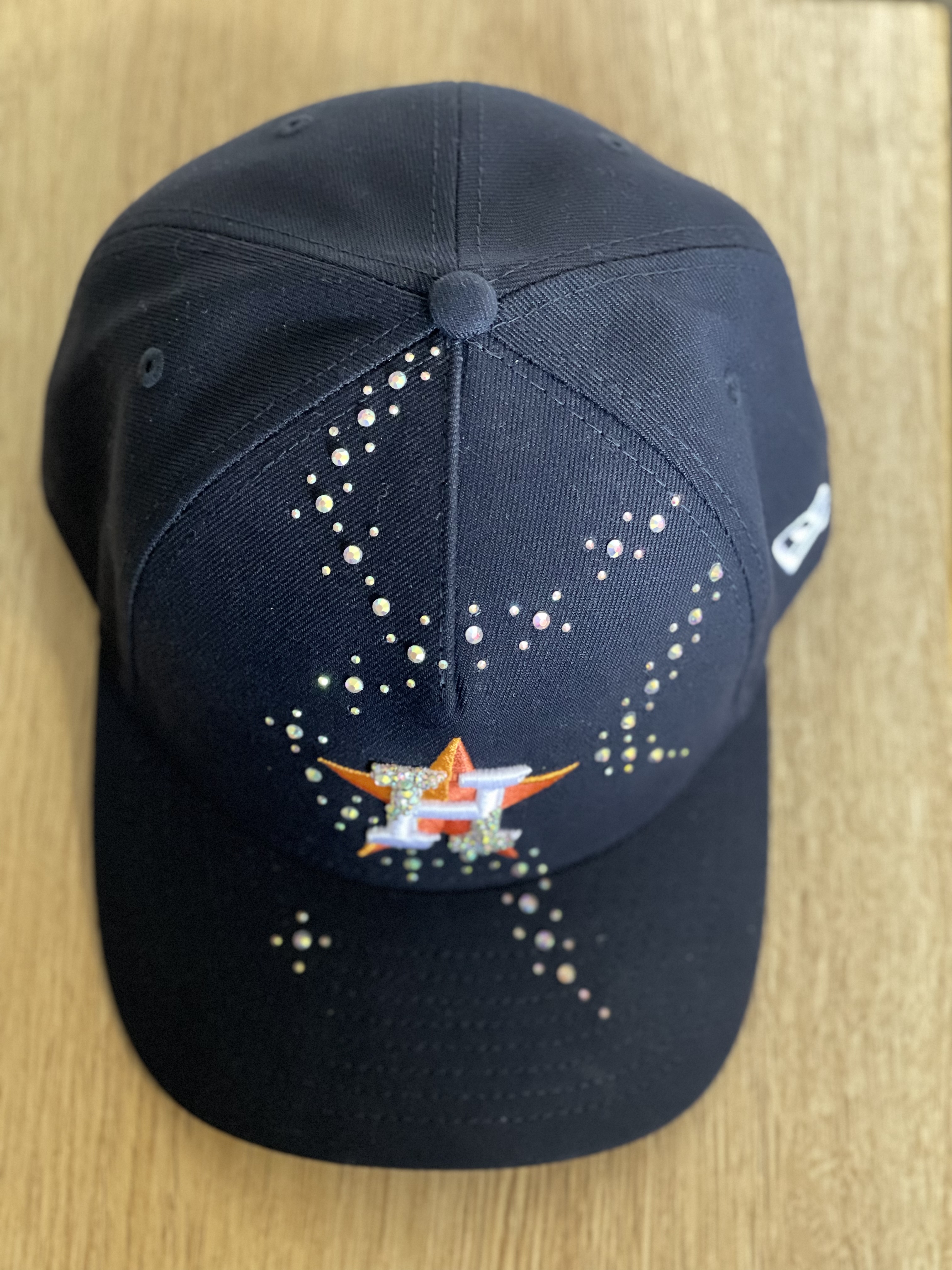 Black Astros snapback with crystal scatter and embellished H logo, top view.