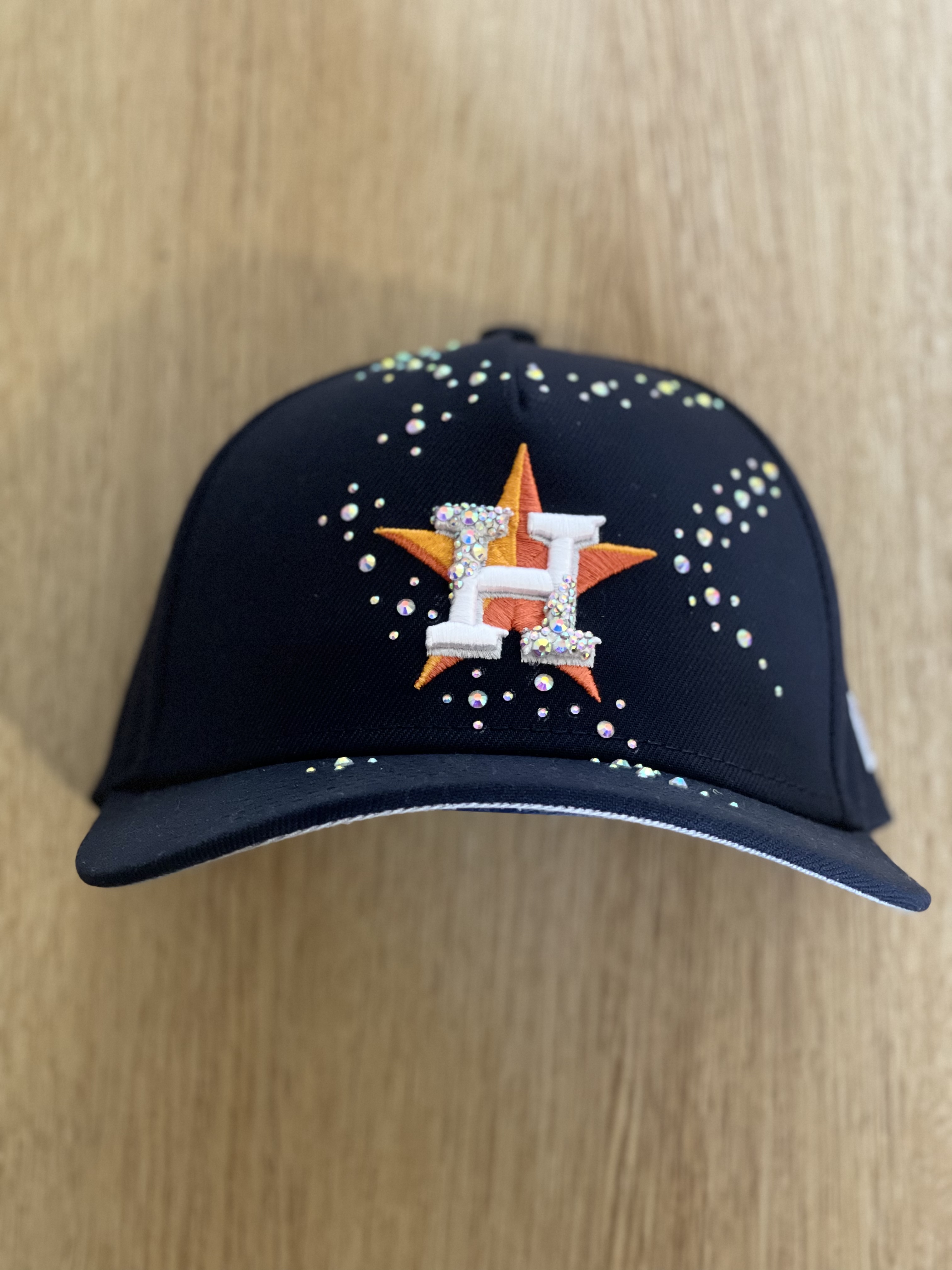 Black Astros snapback with embellished H logo and scattered crystals, front view.